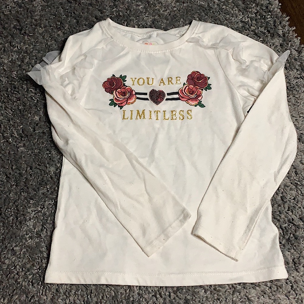 This is a long sleeve childrens shirt in a Size: 7